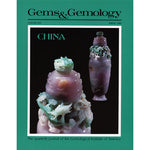 Cover of Gems & Gemology Spring 1986 issue, featuring pink and green stone urn with detailed carvings