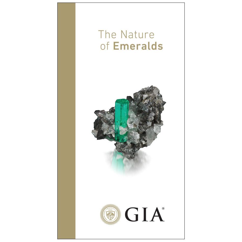 Emerald brochure front, featuring heading "The Nature of Emeralds", rough emerald, and logo