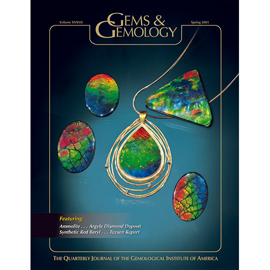 Cover of Gems & Gemology Spring 2001 issue, featuring flat, bright green, red, and blue gemstones