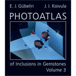 Cover of Photoatlas of Inclusions in Gemstones Volume 3, featuring black inclusion against light blue gem