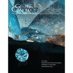 Cover of Gems & Gemology Winter 2023 issue, featuring a 925 ct Texas topaz crystal and a 13.8 ct round Lone Star cut.