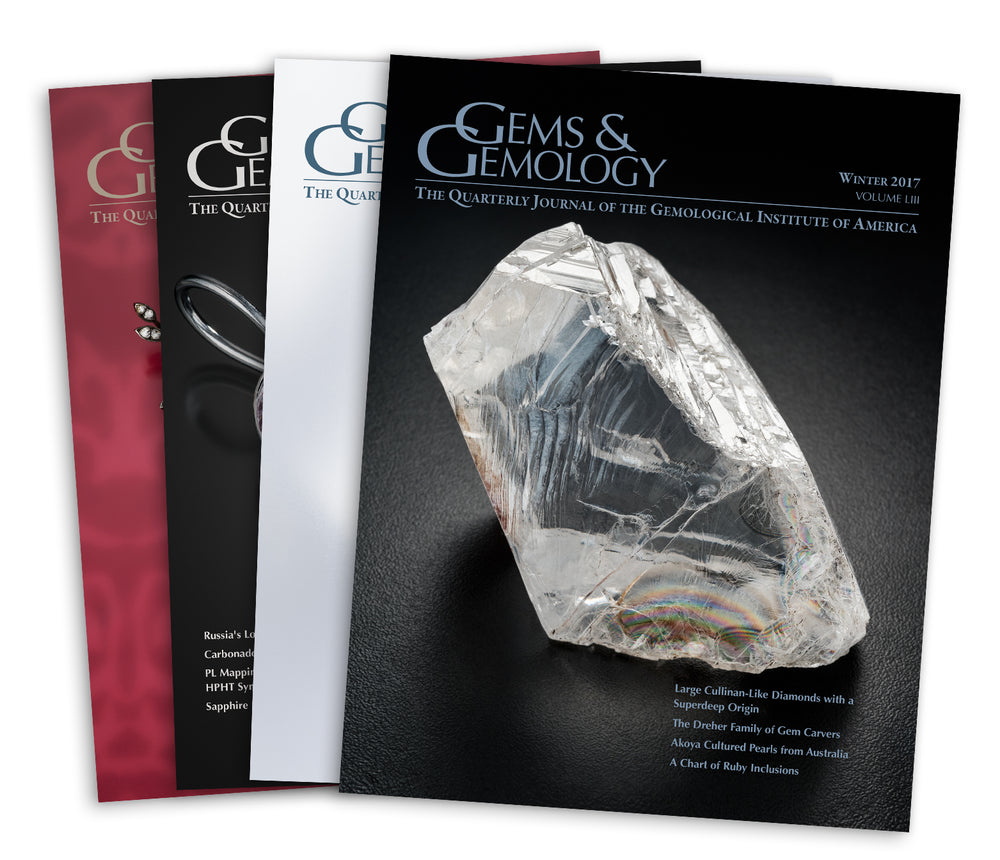Stack of 4 2017 Gems & Gemology issues; top issue features large transparent rough gem
