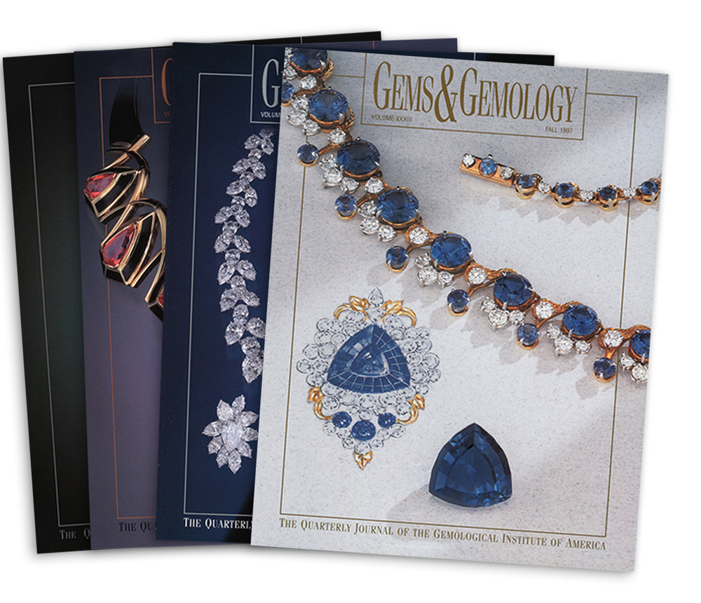 Stack of 4 1997 Gems & Gemology issues; top issue features string of blue and silver jewels