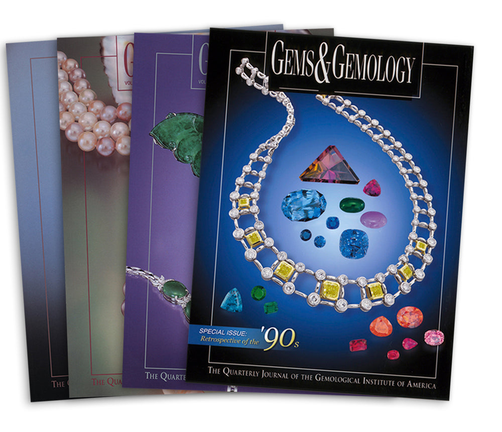 Stack of 4 2000 G&G Issues; top issue features cool-colored gems circled by necklace