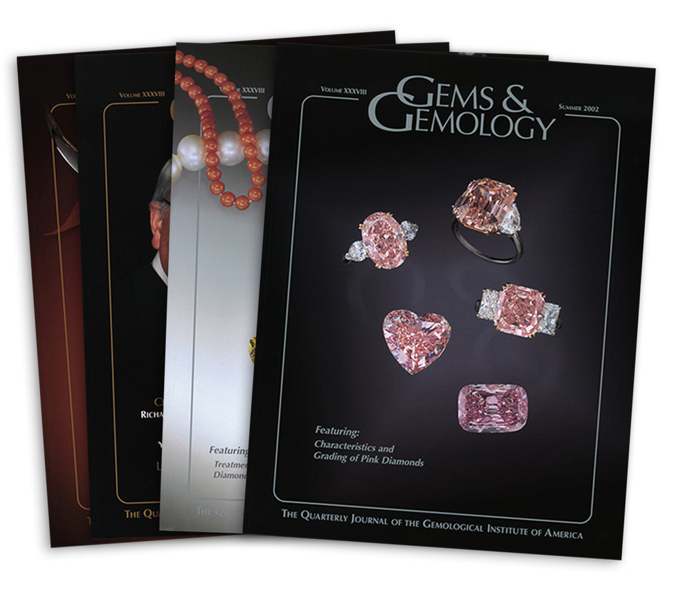 Stack of 4 2002 Gems & Gemology issues, top issue features pale pink rings and gems