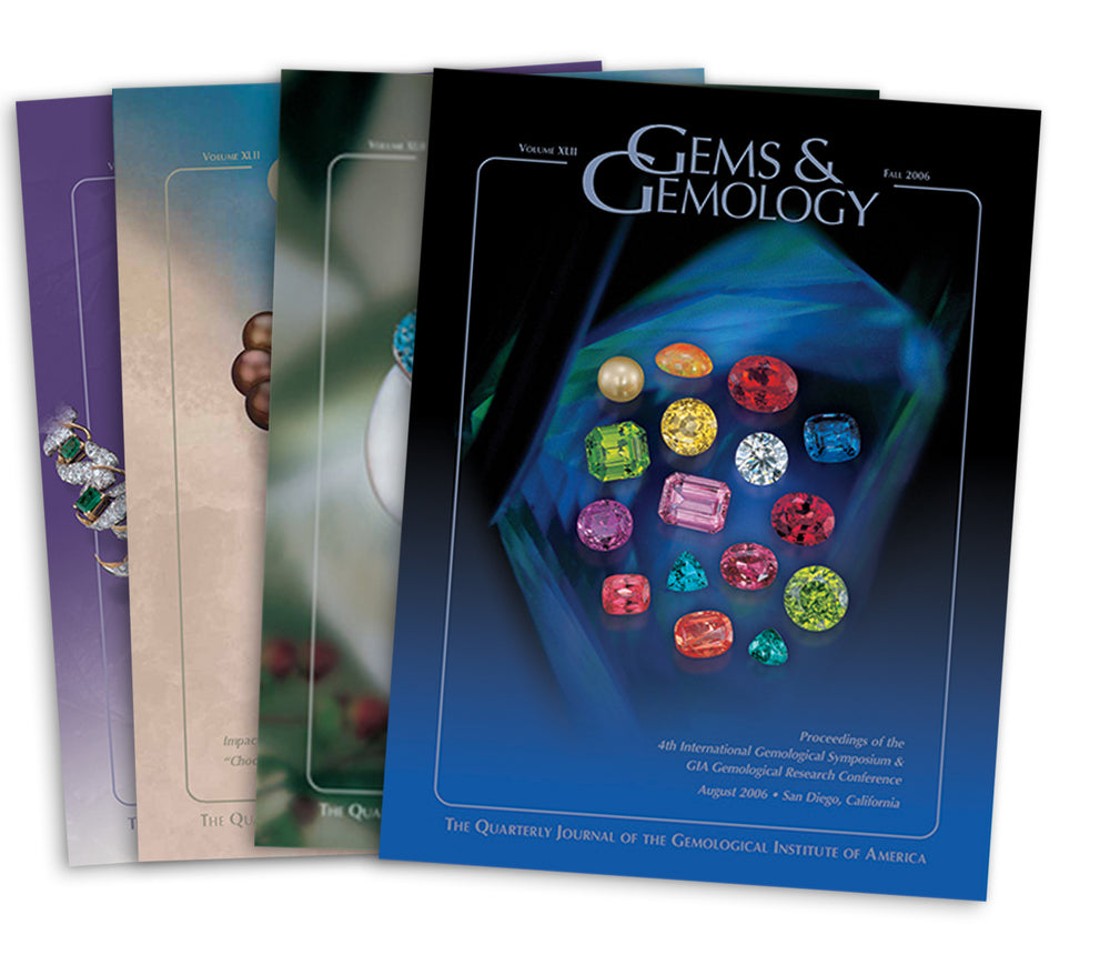 Stack of 4 2006 Gems & Gemology issues; top issue features arrangement of colored gems
