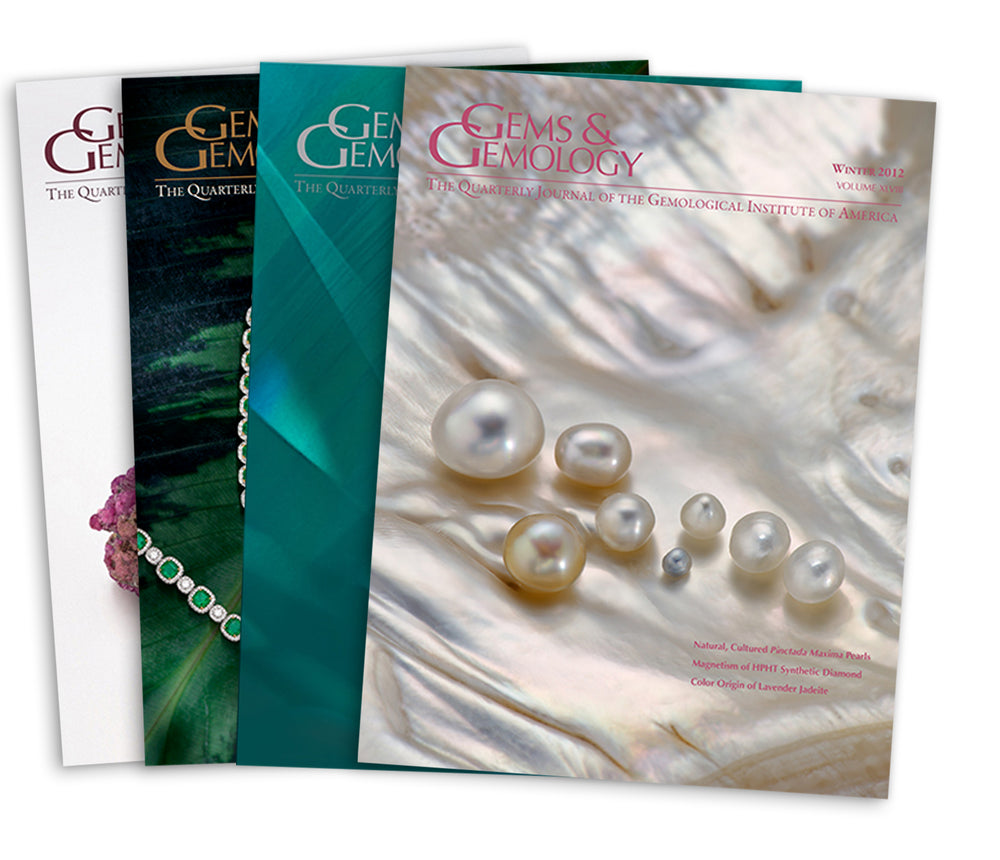 Stack of 4 2010 Gems & Gemology issues; top issue features pearls on silky clam shell background