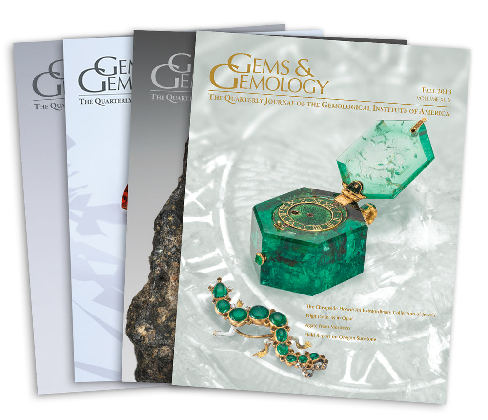 Stack of 4 2014 Gems & Gemology issues, top issue features hinged case made from green gemstone