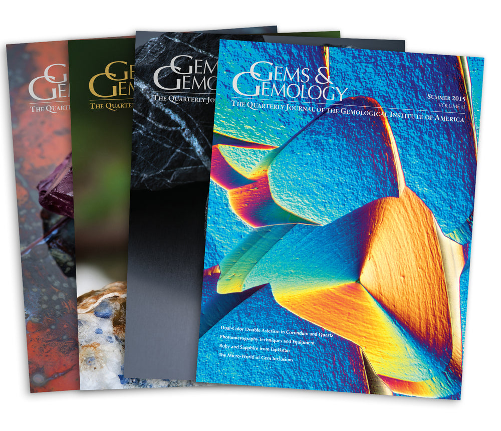 Stack of 4 2015 Gems & Gemology issues; top issue features photomicrograph of colorful surface