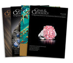 Stack of 4 2018 Gems & Gemology issues; top issue features pink ring