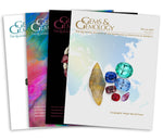 Stack of 4 2019 Gems & Gemology issues; top issue features group of gemstones over world map