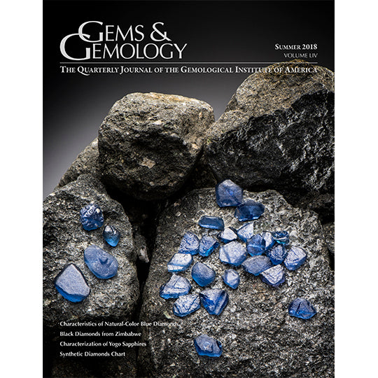 Cover of Gems & Gemology Summer 2018 issue, featuring gray stone with embedded blue gems
