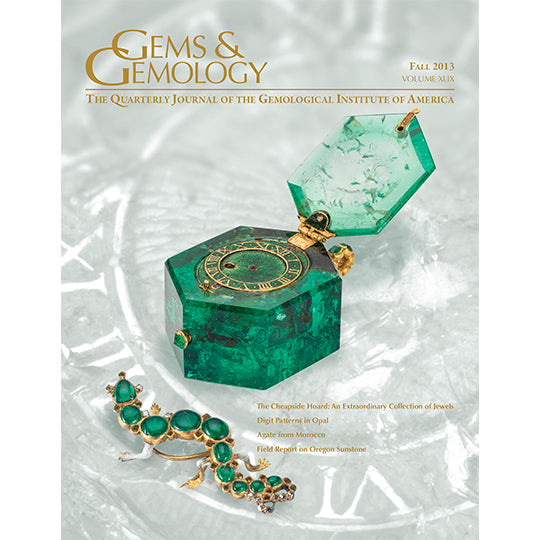 Cover of Gems & Gemology Fall 2013 issue, featuring container with hinge made of green gem
