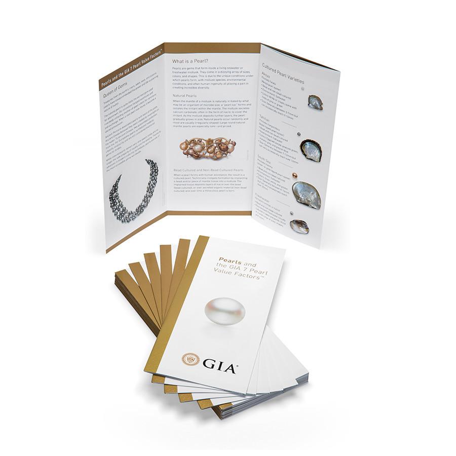 Stack of GIA Pearl brochures next to brochure stood up and opened to show three panels