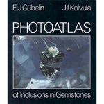 Cover of Photoatlas of Inclusion in Gemstones, featuring close-up image of diamond inclusion