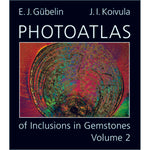 Photoatlas of Inclusions in Gemstones Volume 2 cover, featuring close-up on colorful spiral inclusion