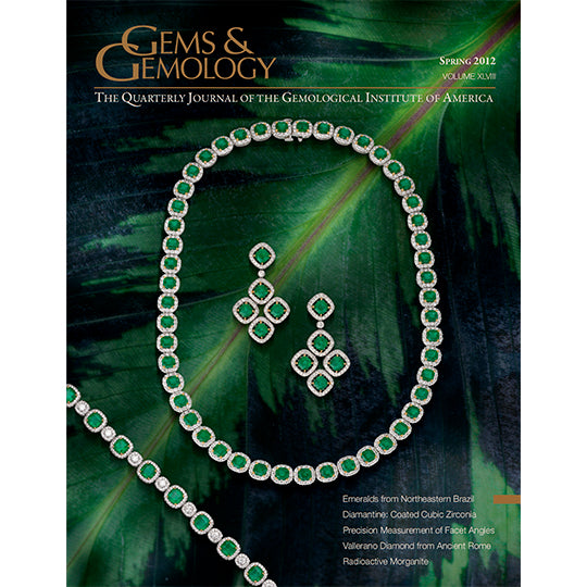 Cover of Gems & Gemology Spring 2012 issue, featuring green jewelry sitting on large leaf