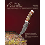 Cover of Gems & Gemology Spring 2022 issue, featuring a Damascus steel knife with a handle crafted from gem dinosaur bone.
