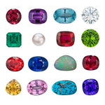 16 assorted polished gemstones lined up in neat rows