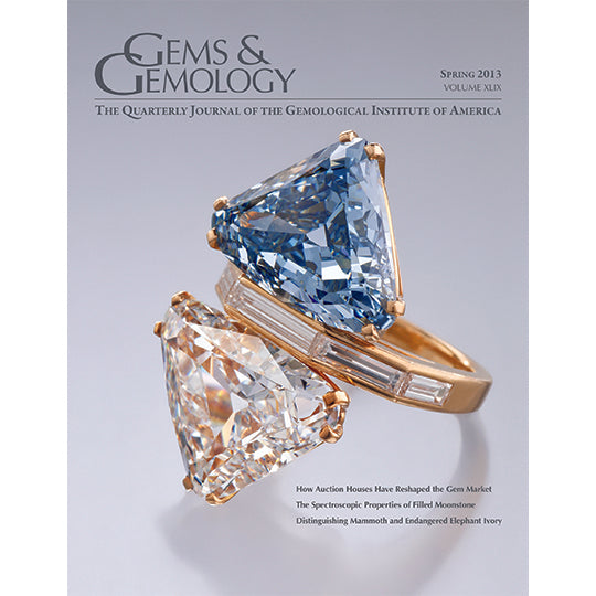 Cover of Gems & Gemology Spring 2013 issue, featuring ring with both a blue and colorless diamond