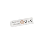 White triangular prism plate with text "Gems with Reports by GIA"