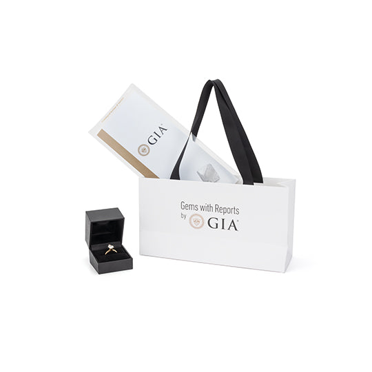 GIA shopping bag shown with pamphlet and diamond in box